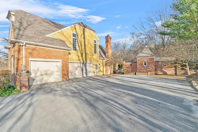 view of side of property with a garage