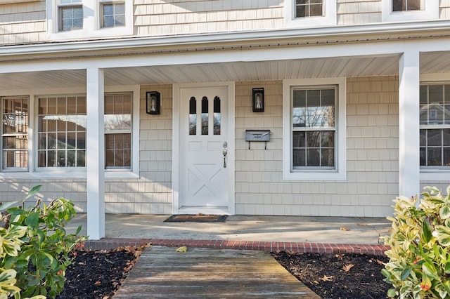 doorway to property with covered porch