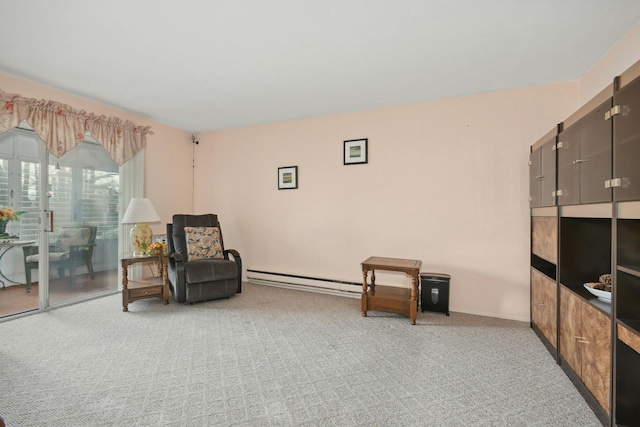 sitting room with carpet and a baseboard radiator