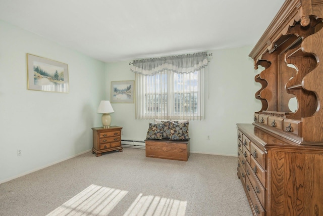 living area with light carpet and a baseboard heating unit