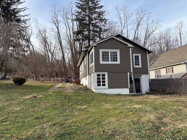 rear view of house with a lawn