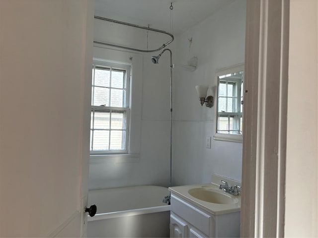 bathroom with shower / tub combination and vanity