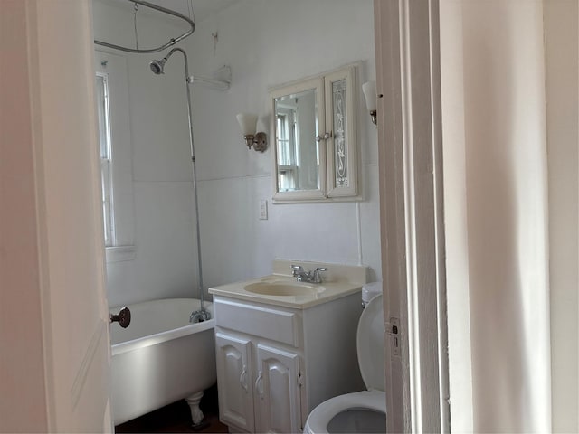 full bathroom with vanity, toilet, and shower / washtub combination