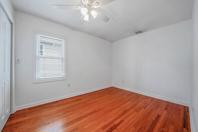 spare room with ceiling fan and light hardwood / wood-style floors