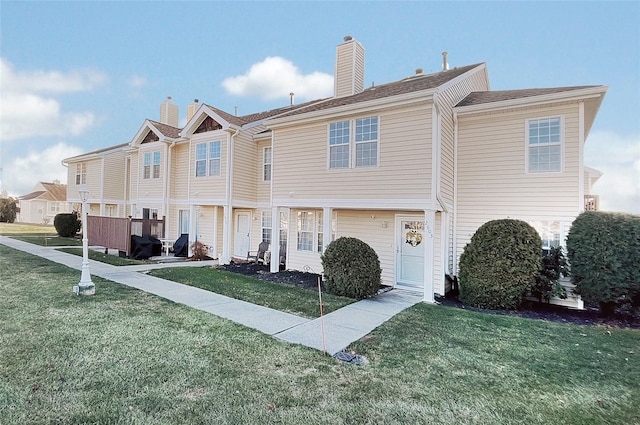 view of property featuring a front yard