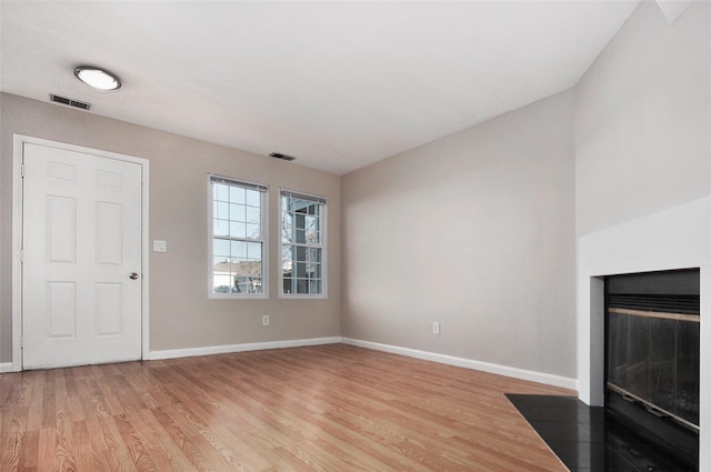 unfurnished living room featuring hardwood / wood-style floors