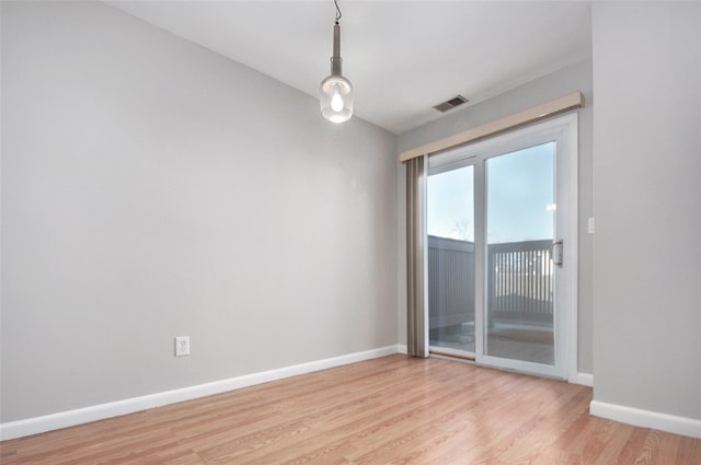 unfurnished room with light hardwood / wood-style flooring