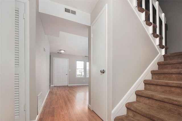 stairway featuring hardwood / wood-style flooring