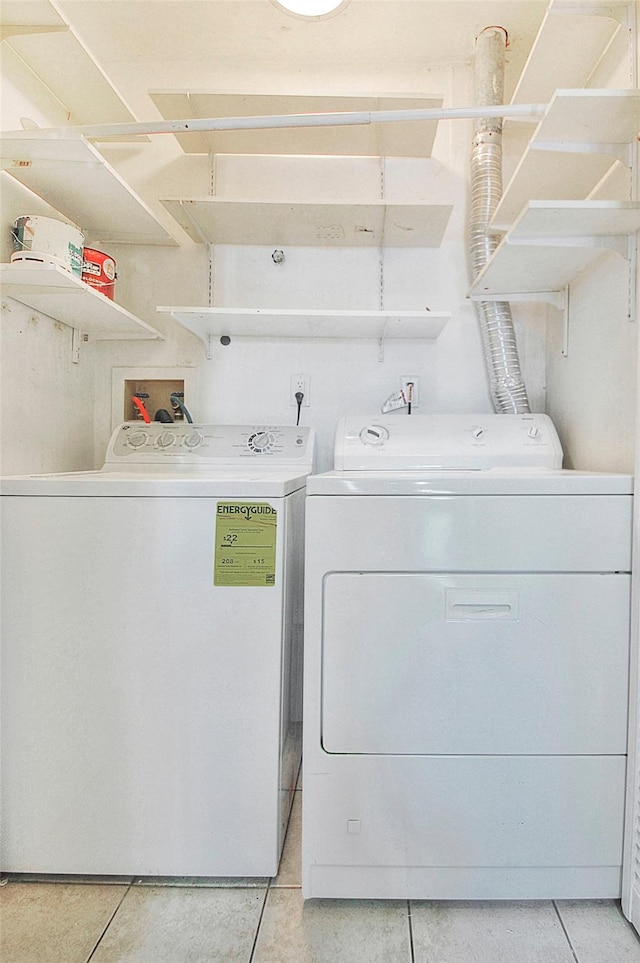 clothes washing area with washing machine and clothes dryer