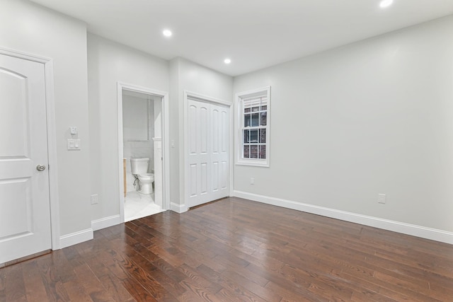 spare room featuring dark hardwood / wood-style floors