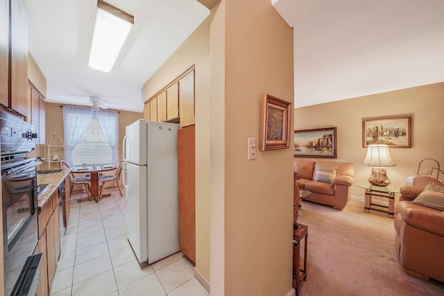 hall with light tile patterned floors