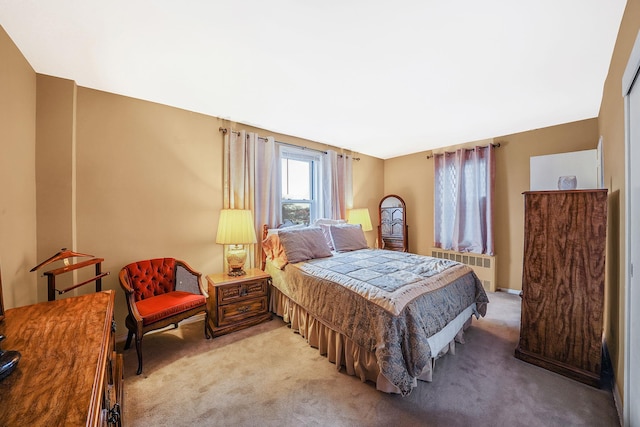 carpeted bedroom featuring radiator heating unit