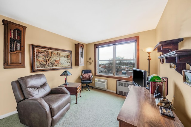 carpeted office featuring a wall unit AC and radiator heating unit