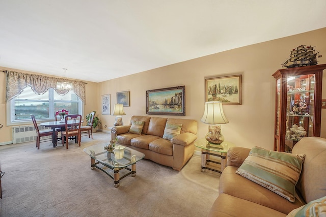 carpeted living room featuring radiator heating unit and a chandelier