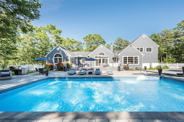 view of swimming pool with a patio area