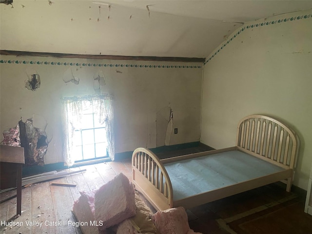 bedroom featuring lofted ceiling