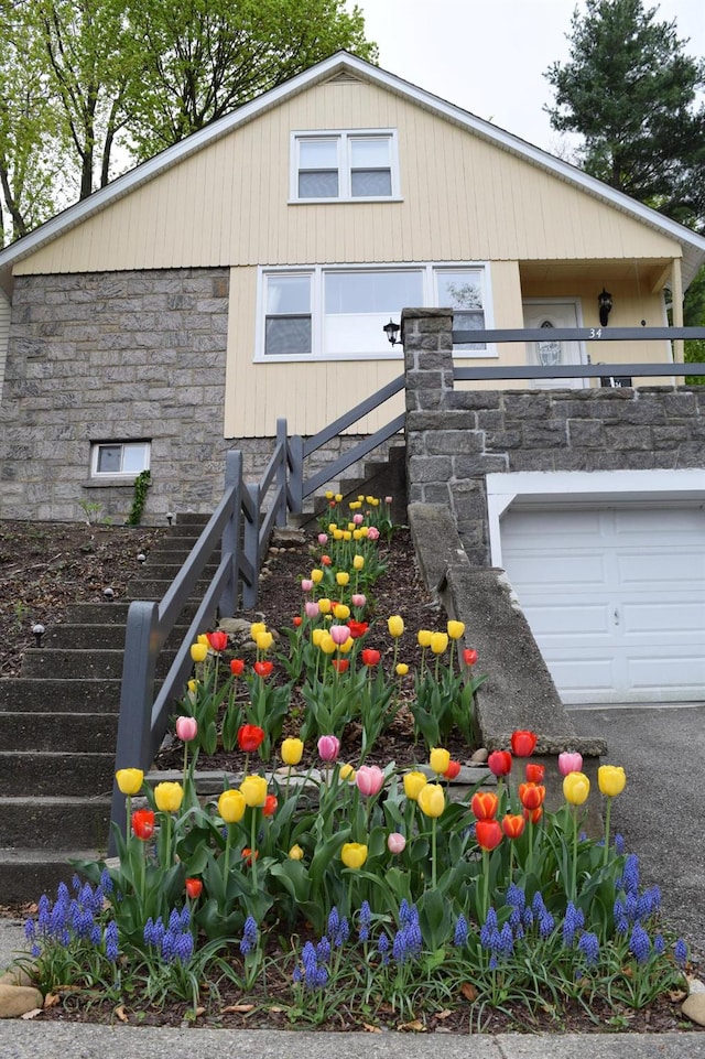 view of front of home with a garage and a balcony