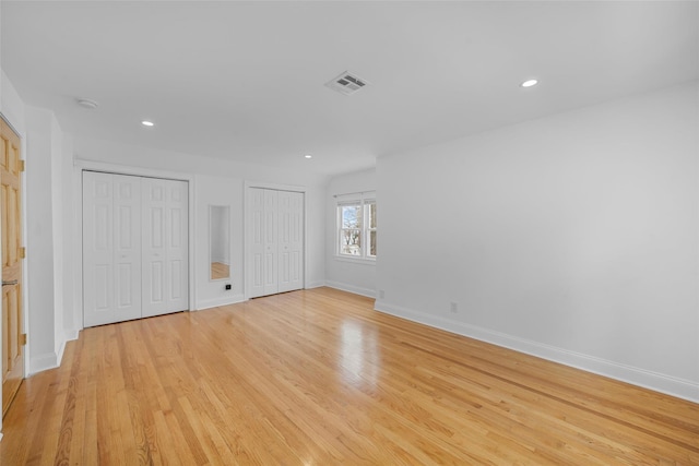 unfurnished room with light wood-type flooring