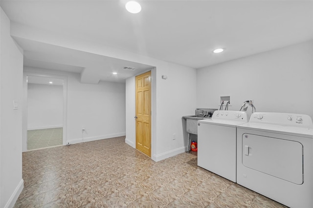 laundry area with washing machine and dryer