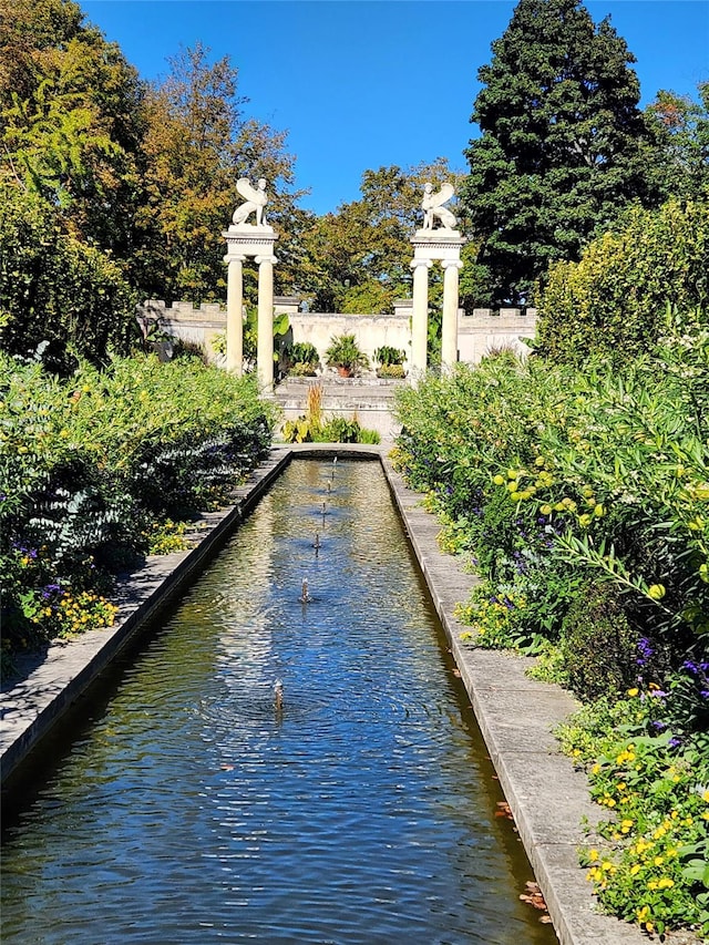 view of swimming pool featuring a water view