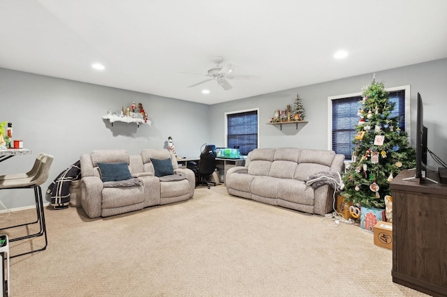 living room with carpet floors and ceiling fan