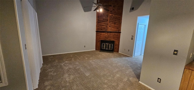 unfurnished living room featuring carpet flooring, ceiling fan, and a fireplace