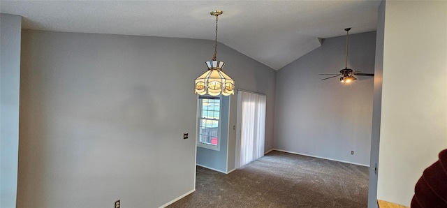 carpeted entrance foyer featuring a textured ceiling, ceiling fan with notable chandelier, and high vaulted ceiling