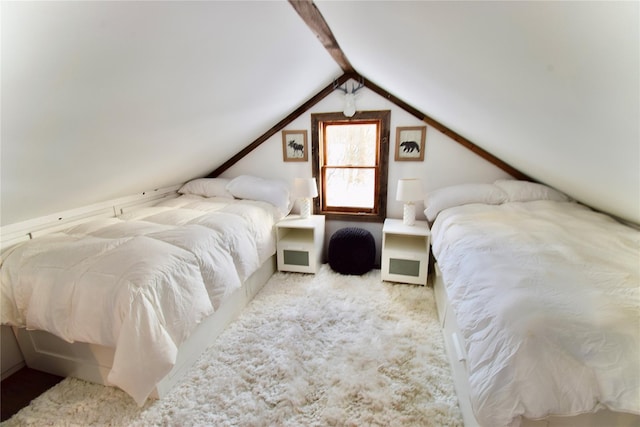 carpeted bedroom with vaulted ceiling