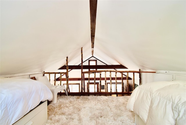 carpeted bedroom with lofted ceiling