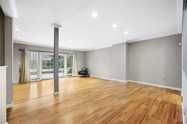 interior space with light hardwood / wood-style floors and ornamental molding