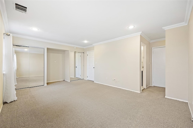 interior space featuring crown molding and light carpet