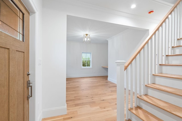 entrance foyer featuring recessed lighting, stairway, ornamental molding, wood finished floors, and baseboards