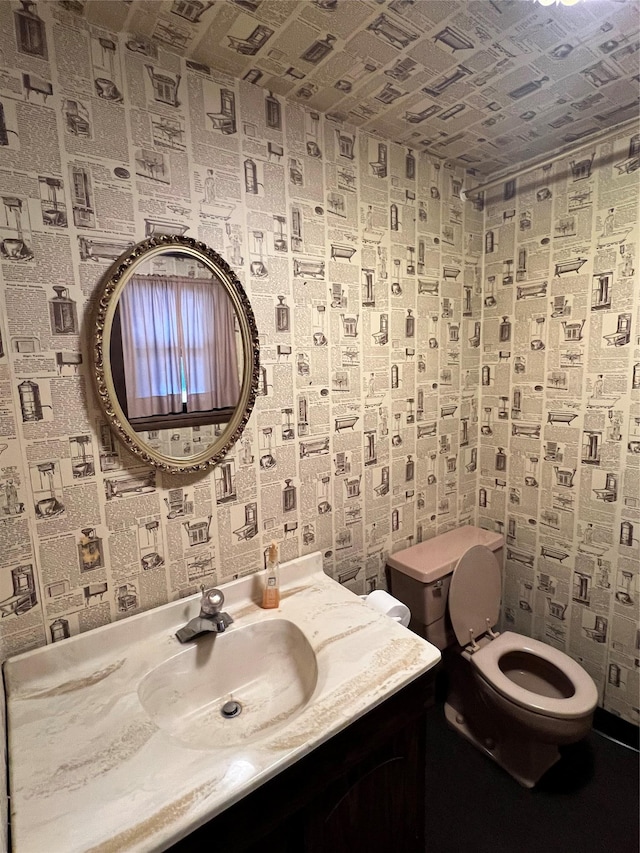 bathroom with vanity and toilet