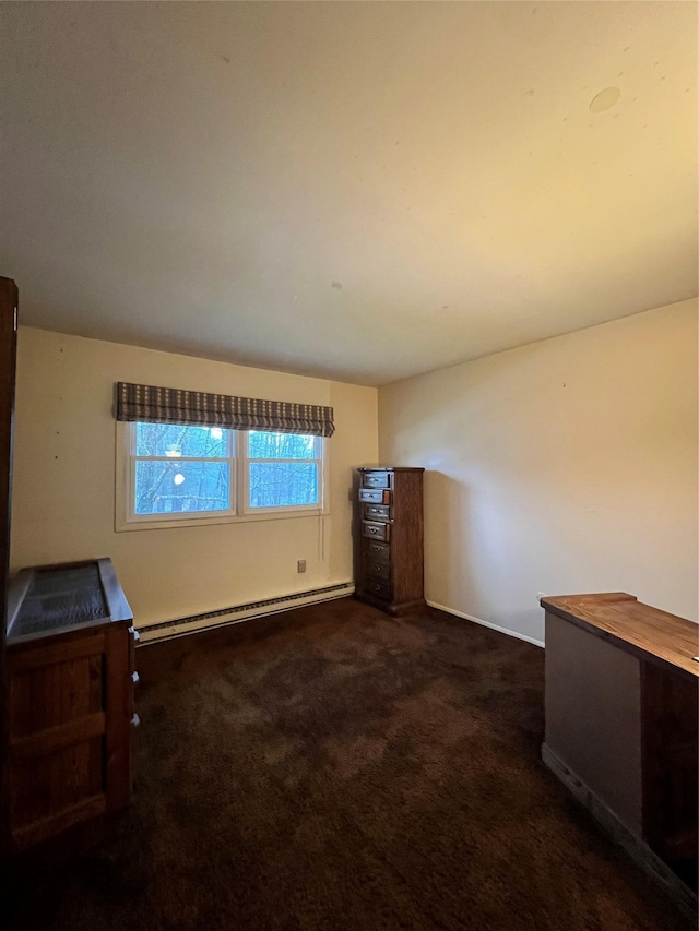 carpeted spare room with baseboard heating