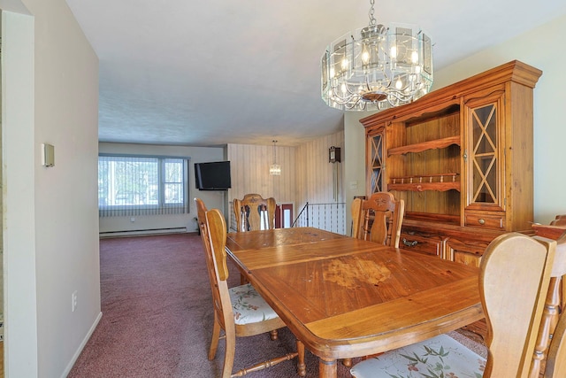 carpeted dining room featuring baseboards, a baseboard heating unit, and a chandelier