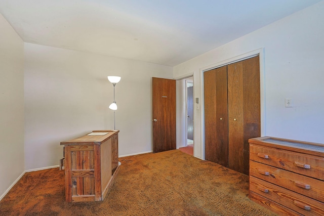 hall with carpet and baseboards