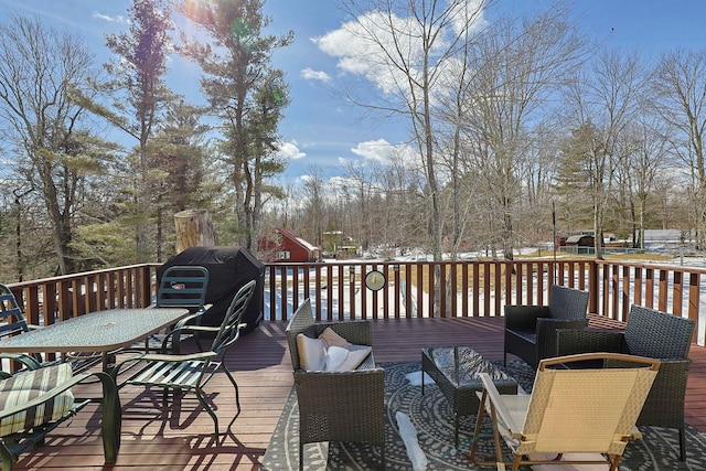 wooden deck featuring outdoor dining space and an outdoor living space