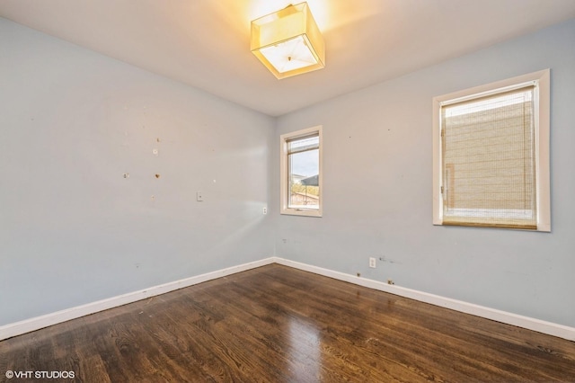 empty room with hardwood / wood-style floors