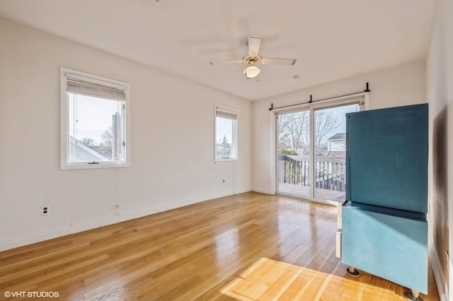 unfurnished room with wood-type flooring and ceiling fan