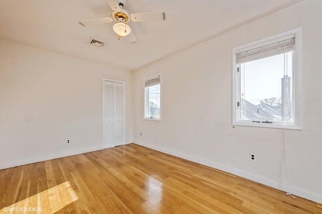 unfurnished room featuring ceiling fan and hardwood / wood-style floors