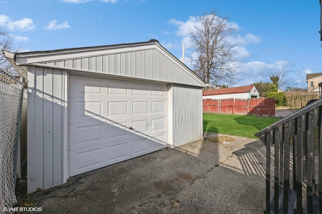 garage featuring a lawn