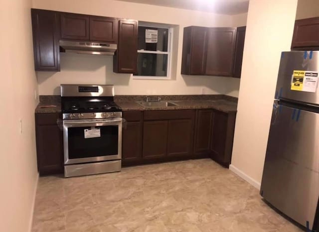 kitchen featuring dark brown cabinetry, stainless steel appliances, and sink