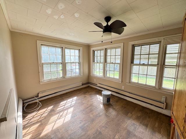 unfurnished room with a baseboard radiator, hardwood / wood-style flooring, ornamental molding, and ceiling fan