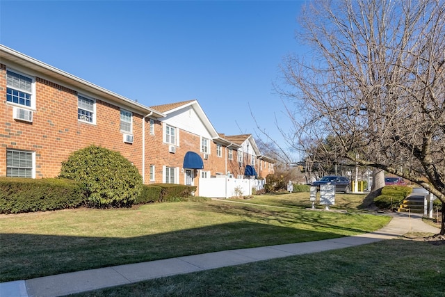 view of home's exterior with a yard