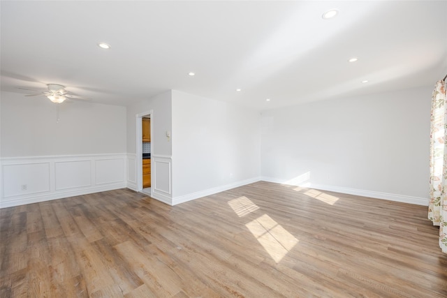 empty room featuring light hardwood / wood-style floors and ceiling fan