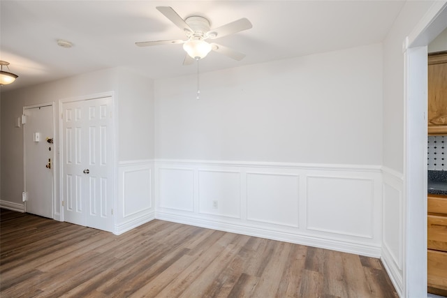 spare room with ceiling fan and hardwood / wood-style floors