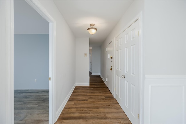 corridor featuring dark wood-type flooring