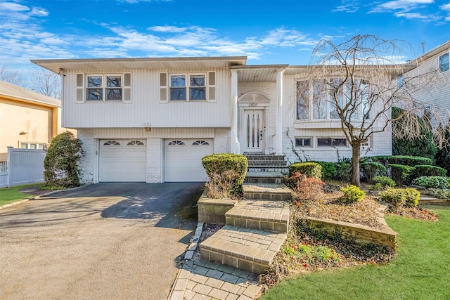 1070 Fordham Ln, Woodmere, NY 11598 - split foyer home featuring a garage