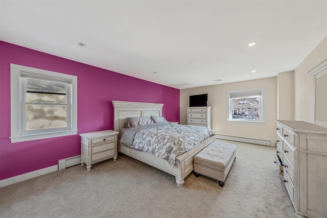 carpeted bedroom with a baseboard heating unit