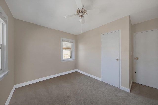 unfurnished bedroom with ceiling fan and carpet flooring